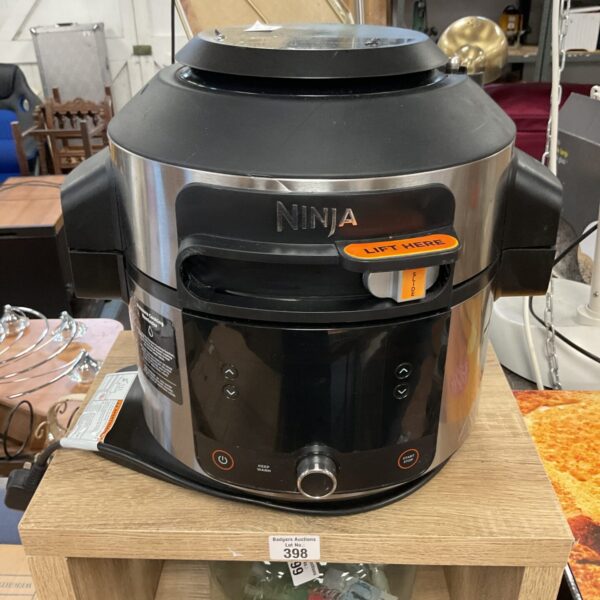 Black Ninja Foodi Max multi cooker with smart lid displayed on a table.