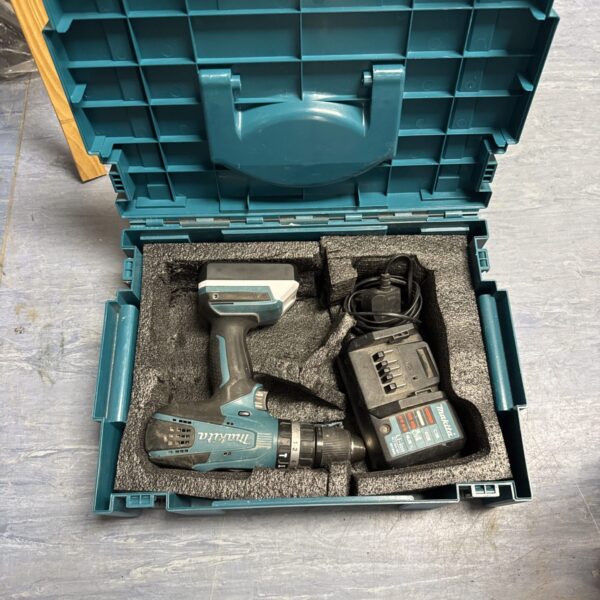 Makita cordless drill in open case with charger.