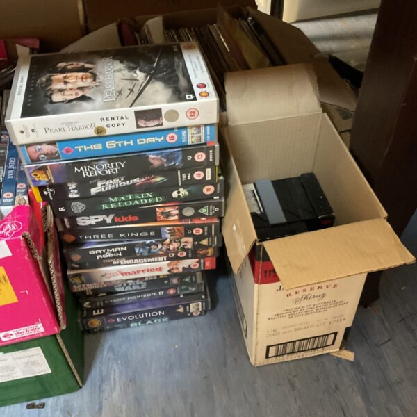 Vintage VHS tape collection with rental and home-recorded movies.