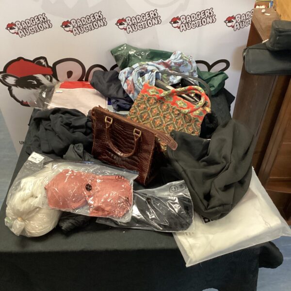 Mixed lot of handbags, leggings, umbrellas and bed covers.