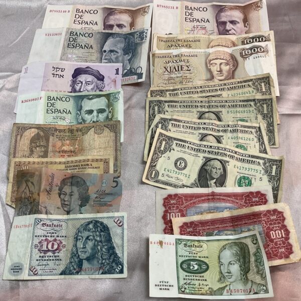 Collection of vintage overseas banknotes, including Spanish and Greek currency.