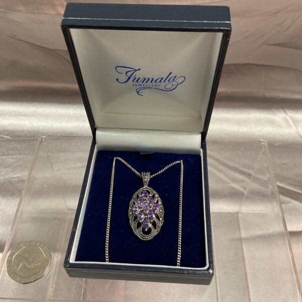 Vintage silver and amethyst pendant necklace, a beautiful gemstone piece.