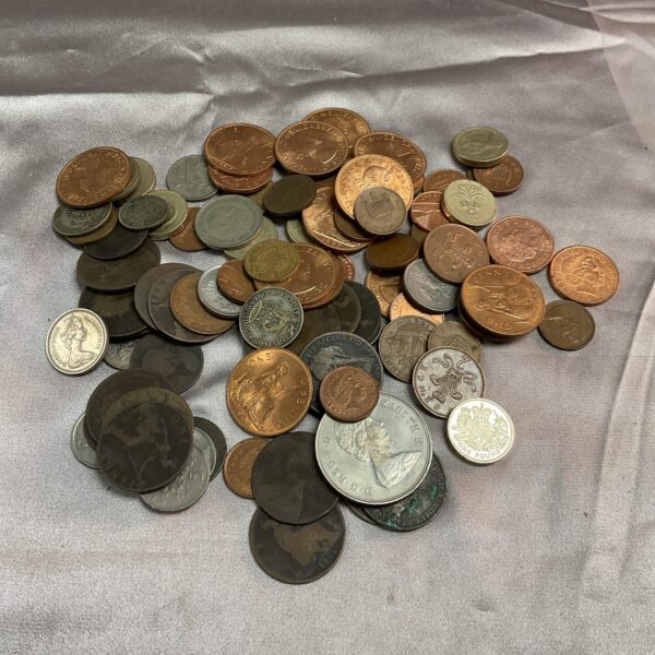 Assorted UK coins in a mixed vintage lot for collectors.