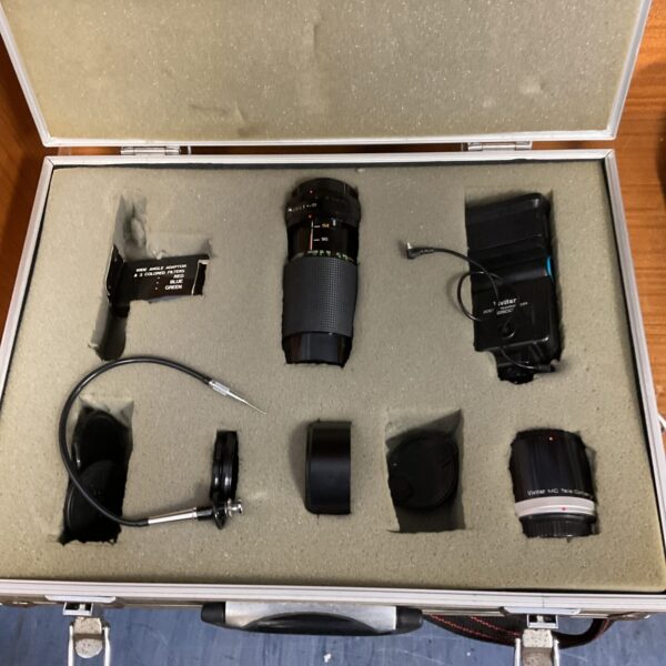 Vintage camera lens kit in aluminium case, photography equipment.