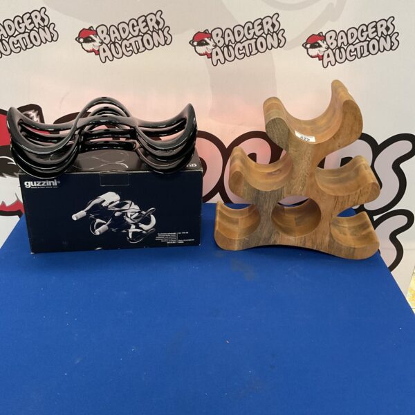 Vintage wine rack holders, including a Guzzini design and wooden holder.