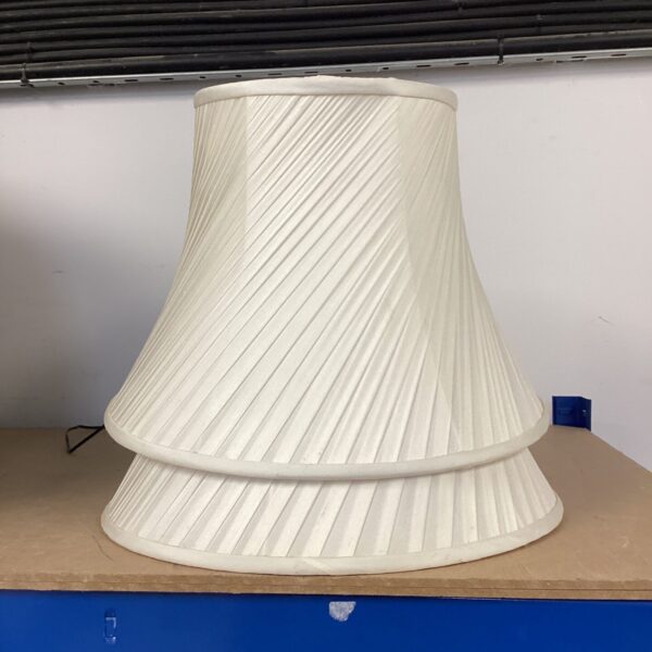 Vintage cream lamp shade with pleated fabric texture.