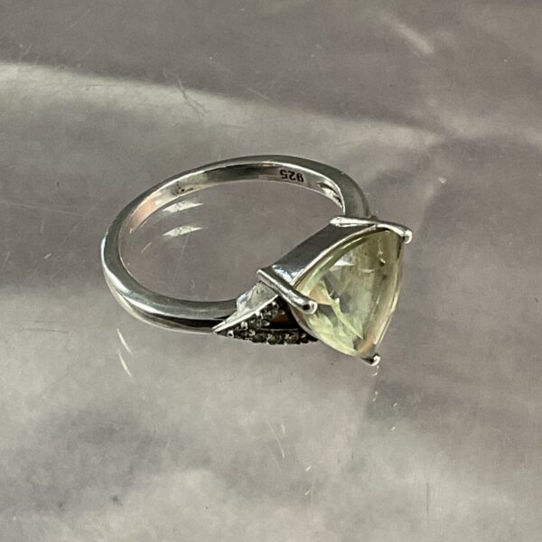 Silver ring with a triangular white stone, size P.