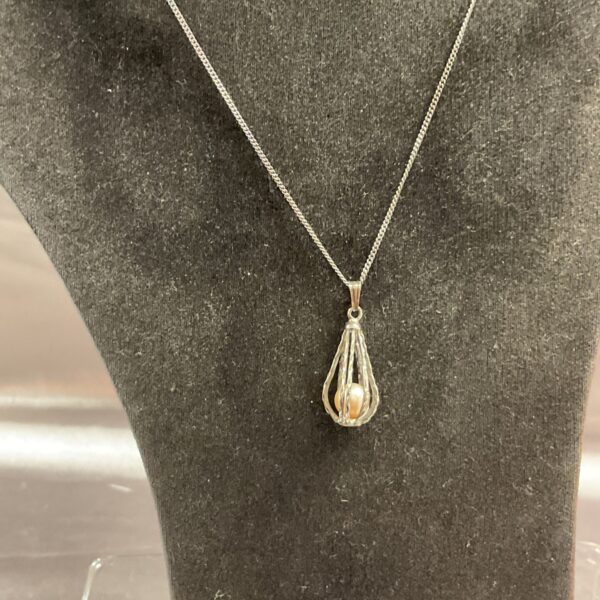 Silver freshwater pearl cage pendant necklace by Guernsey pearl.