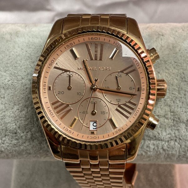 Gold tone Michael Kors quartz wristwatch, stylish fashion accessory.