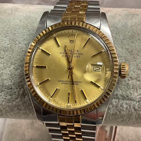 Vintage Rolex Oyster Perpetual Datejust automatic wristwatch with gold accents.