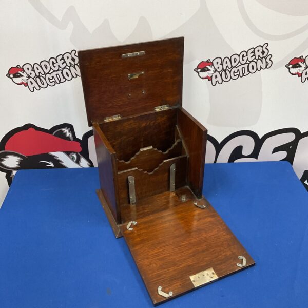 Vintage oak stationary letter box with lid open.