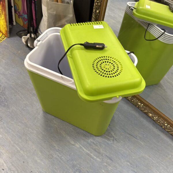 Front view of a green 12v DC portable cool box.