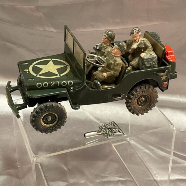 Vintage Arnold clockwork Jeep with soldiers, side view.