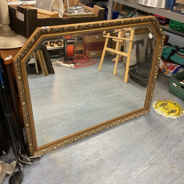 Ornate French overmantle mirror with bevelled edge and gold frame.