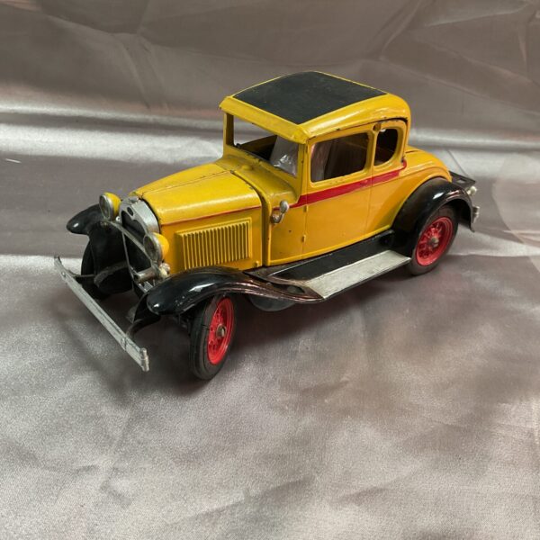 Yellow and black Hurley Ford Model A Victoria Coupe diecast car.