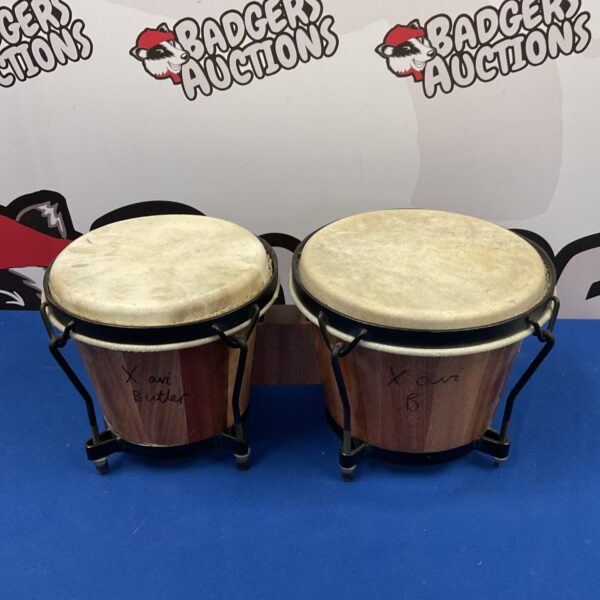 Pair of traditional Indian bongos, wooden shells and skin heads.