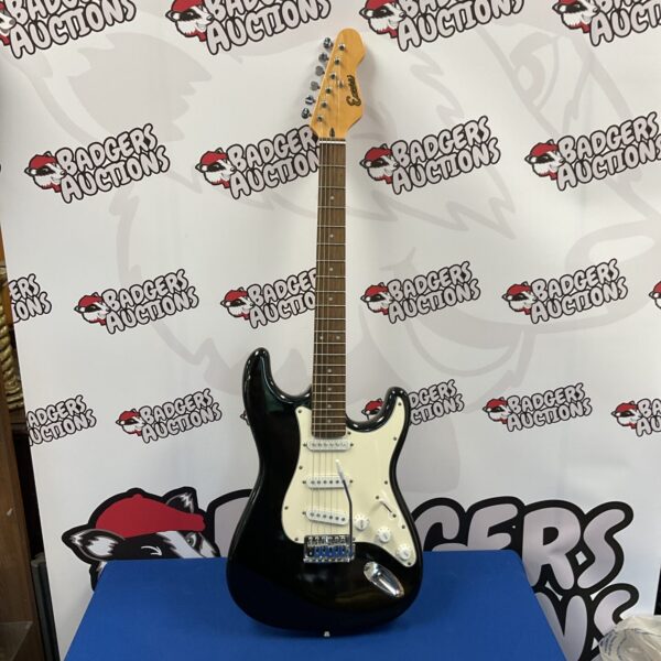 Black Encore electric guitar with single coil pickups.