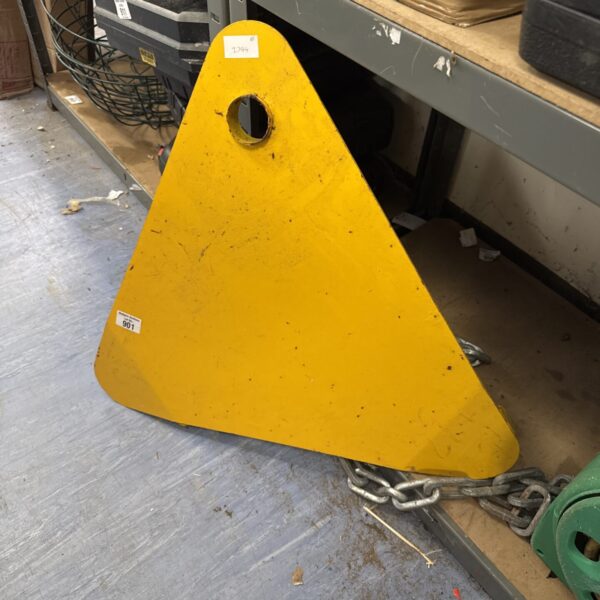 Yellow vehicle wheel clamp for car security and immobilisation.