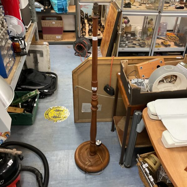 Vintage 1930s oak standard lamp with circular base.