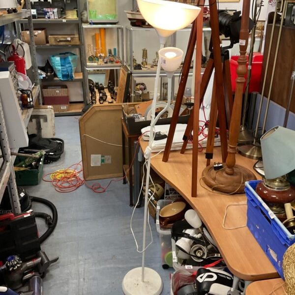 White Ikea standard floor lamp with flexible reading lamp arm.