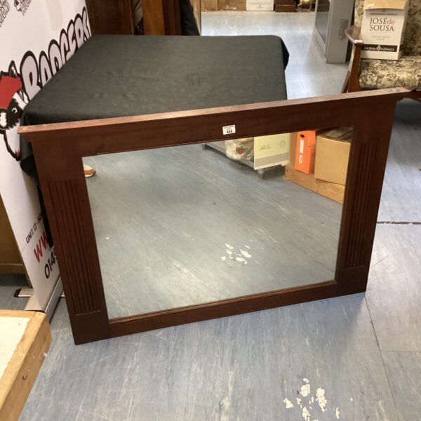 Large mahogany framed wall mirror for vintage home decor.
