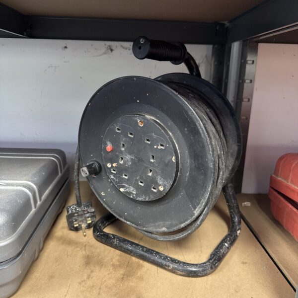 Four-gang extension reel for portable power in workshops.