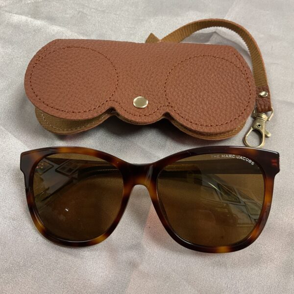 Stylish Marc Jacobs sunglasses with protective case.