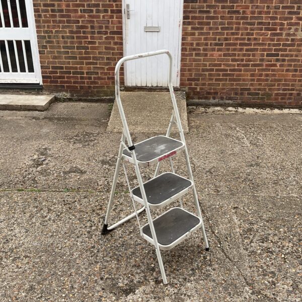White Taurus folding step ladder for household use.