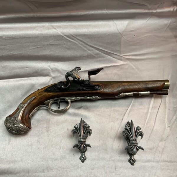 Detailed reproduction of a colonial Hawkins flintlock pistol with wall brackets.