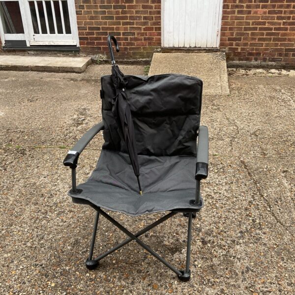 Vango camping chair with integrated umbrella for outdoor use.