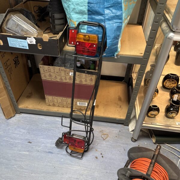 Metal framed trailer lightboard with integrated lights for towing.