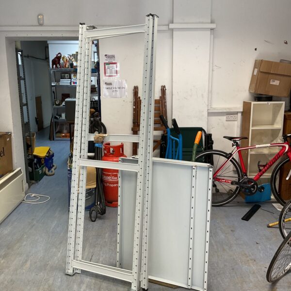 Heavy duty metal shelving unit for garage or workshop storage.