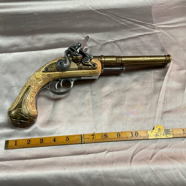 Detailed colonial style flintlock pistol reproduction for collectors.