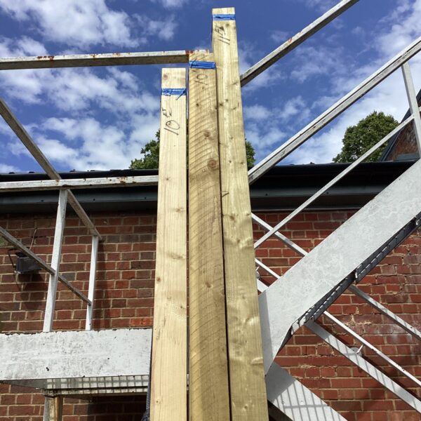 Long bundles of timber for construction and DIY projects.