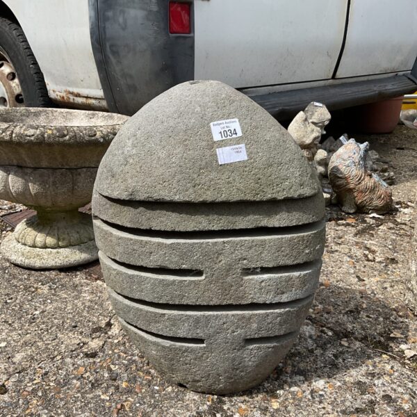 Large stone garden candle holder for outdoor lighting and ambiance.