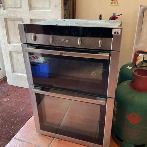 Front view of a stainless steel Neff integrated oven.