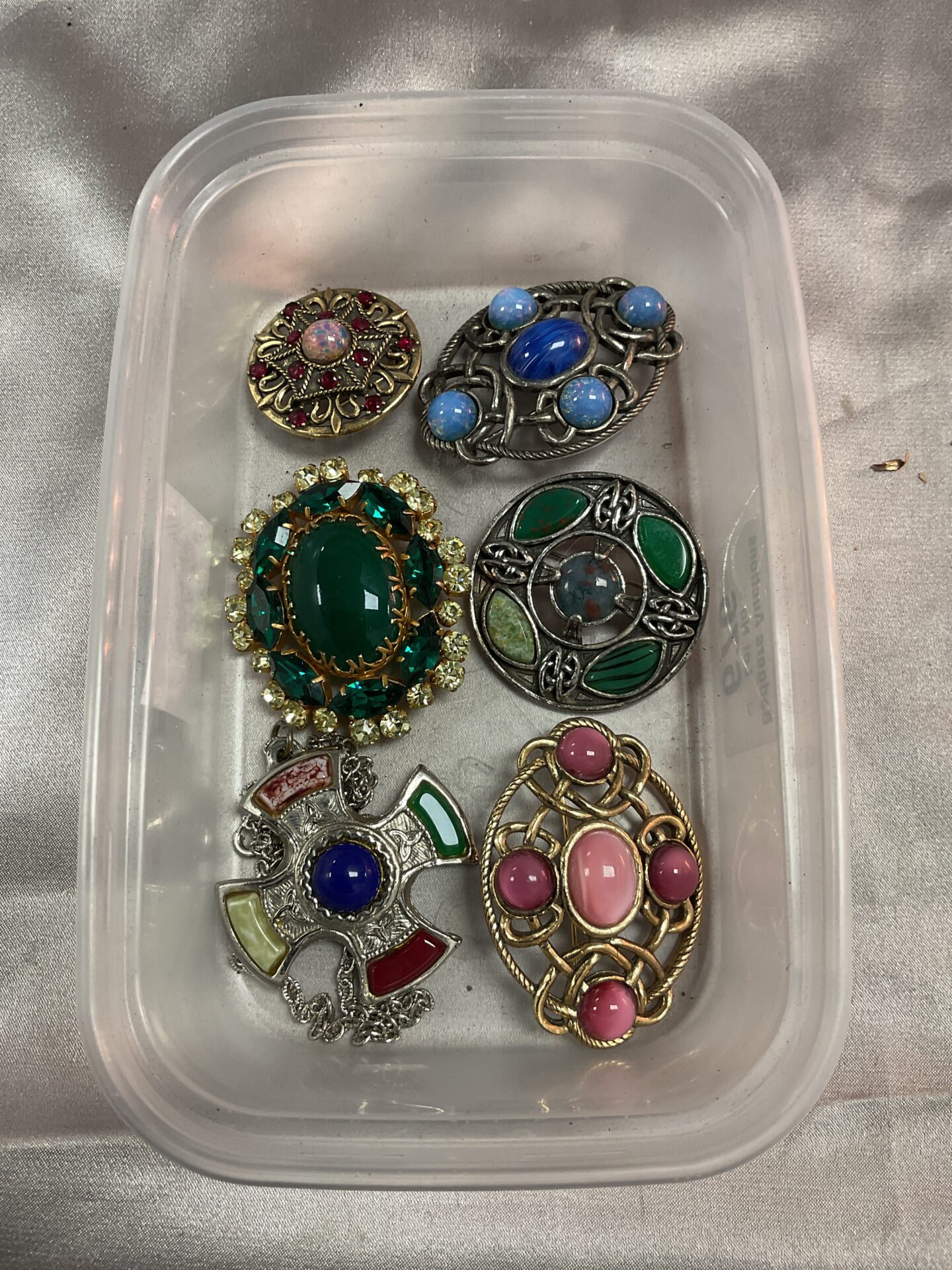 676 Five vintage brooches and pendant necklace inc miracle