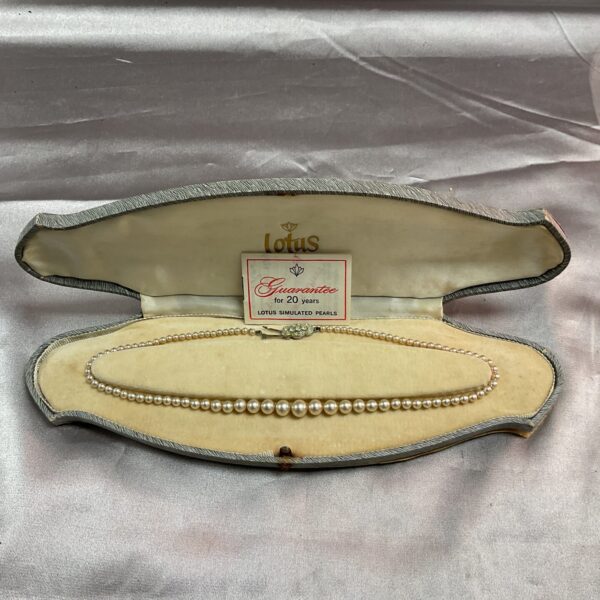 Vintage simulated pearl necklace in original presentation case.