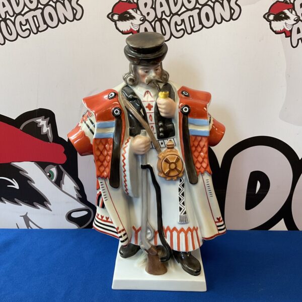 Detailed Herend porcelain hussar figure with pipe and shotgun.