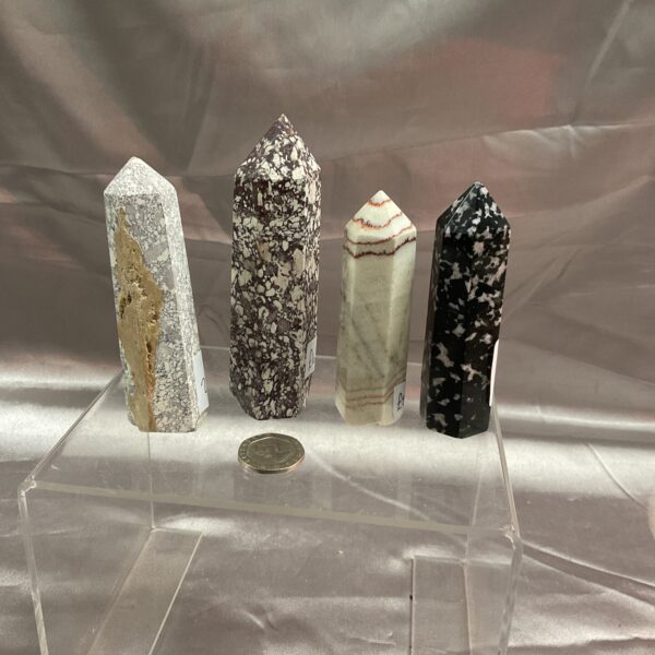 Lot of four unique crystal pillars for collectors and home decor.