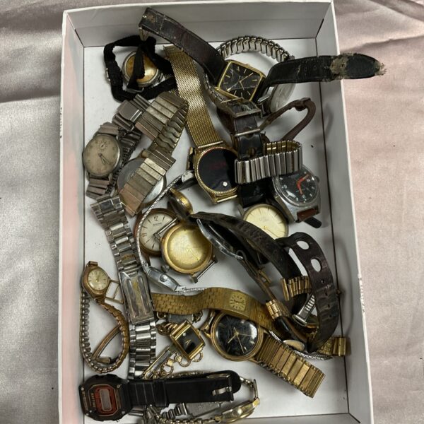 Tray of assorted vintage and broken wristwatches for repair.