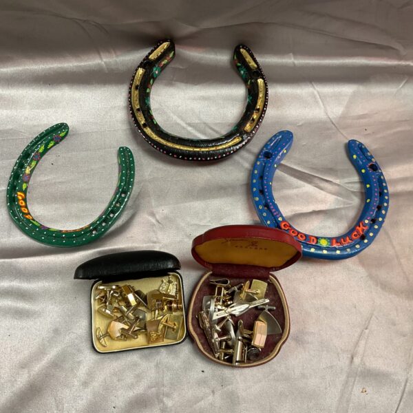Vintage decorative horseshoes and assorted cufflinks lot for collectors.