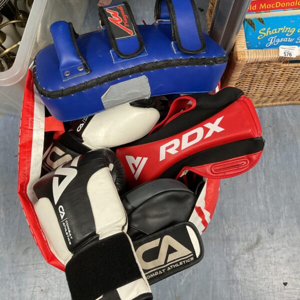 Boxing sparring pads set including Everlast and Combat Athletics brands.