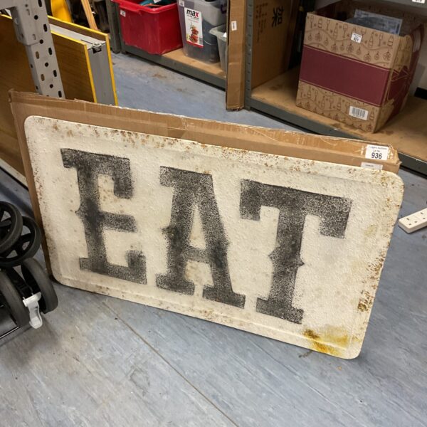 Large vintage metal ‘EAT’ sign for kitchen or diner decor.