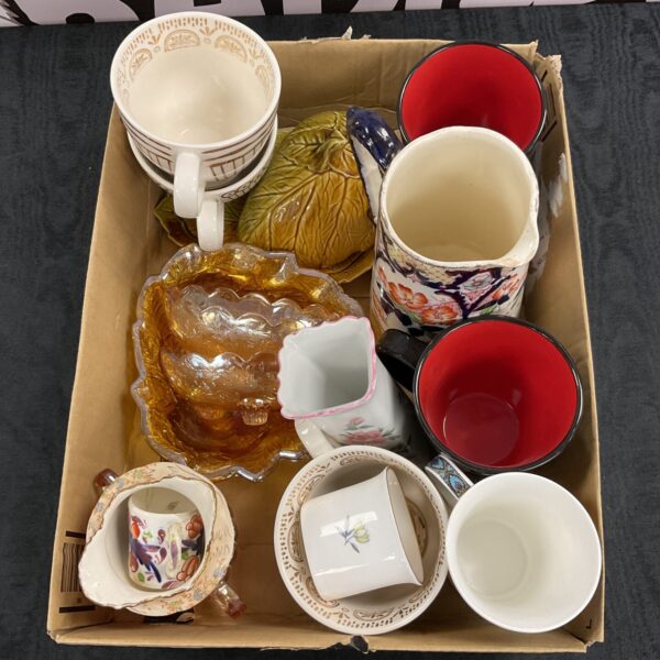 Vintage china assortment with colourful carnival ware and antique teacups.