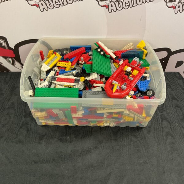 Mixed Lego lot with colourful bricks and minifigures for building.