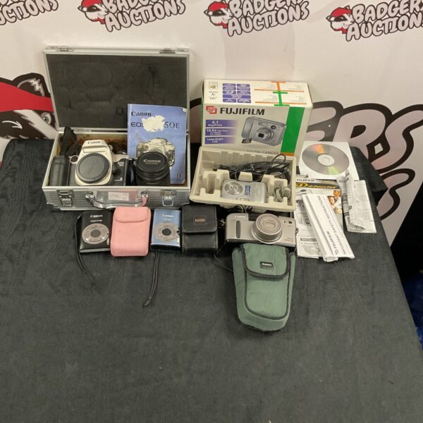 Vintage Canon and Fujifilm cameras in a mixed lot for collectors.