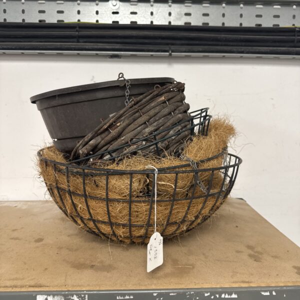 Lot of six assorted hanging flower baskets for garden display.