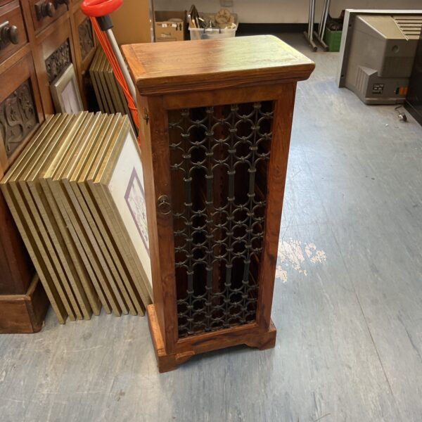 Vintage Indian wood CD rack with cast metal front.