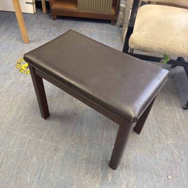 Vintage piano stool with leather seat and wooden legs.
